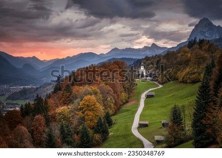 Church on the Alpine mountain hills. Autumn mountain forest church. Church in autumn mountain forest. Church in autumn Alps