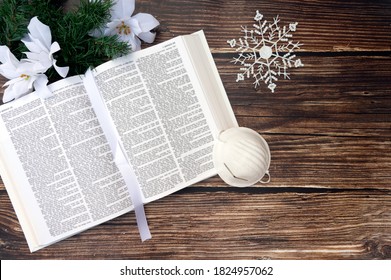 Church On Christmas With Bible, Face Mask And Poinsettia Flowers On Holiday Background. Christian Concept.	