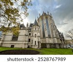 The church of our lady of victories at the sablon in Brussels, Belgium, is a stunning example of gothic architecture, featuring beautiful stained glass and rich historical significance.