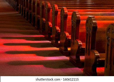 Church Pews in Reflected Stained Glass Lighting