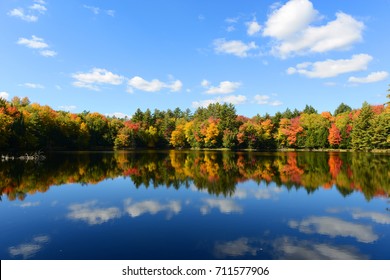 Church Pond in fall with foliage in town of Paul Smiths, Adrondack Mountains, New York, USA.