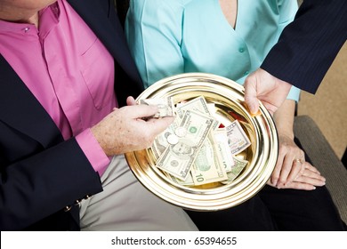 Church Receives Donations By Passing The Collection Plate.