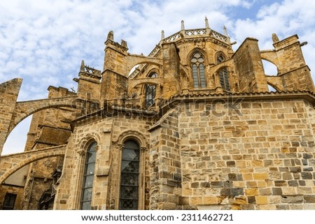 The Church of Santa Maria de la Asuncion, religious landmark, a blend of Gothic and Romanesque styles, with intricate stone carvings, and impressive bell tower. Castro-Urdiales, Cantabria, Spain.