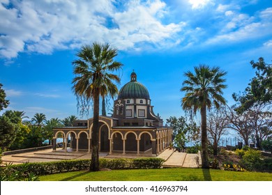 Church Sermon on the Mount - Mount of Beatitudes. Beautiful park of cypress and palm trees. Sea of Galilee, Israel