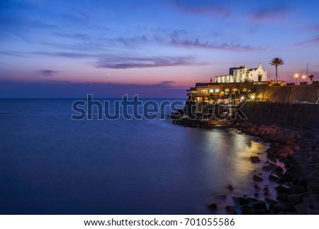 Church of Soccorso with evening illumination at sunset. Italy, Ischia. Free space for text.