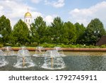 Church of St. George on Poklonnaya hill in victory Park in Moscow Russia among green trees and fountains with space for copying