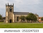 Church of St. John the Evangelist, Seaham UK. Completed in 1840 to a design by Thomas Prosser. Perpendicular style in sandstone with limestone dressing. Image from 2013.