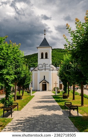 Church of st. John of Nepomuk in Oravsky Podzamok, a nicely renovated Catholic church. View from the walking alley from the front of the building