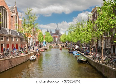 Church of St Nicholas, old town canal at spring day, Amsterdam, Netherlands