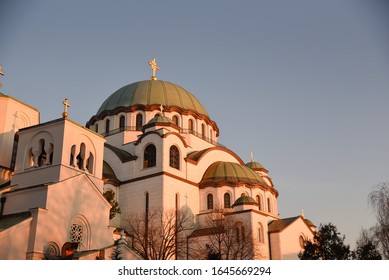 Church Of St. Sava In Belgrade During The Warm Winter Sunset Positioned In The Lower Left Part And With Negative Space In The Upper Right Part Of The Frame