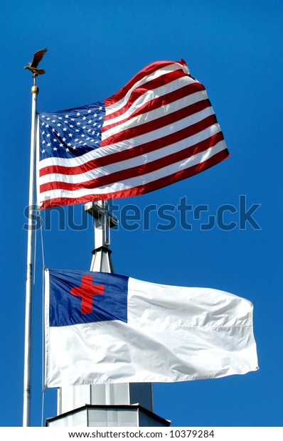Church stands between the Christian flag and the\
American Flag.
