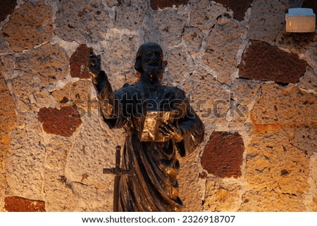 Church statue of a saint outside the church on mass day