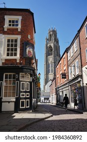 Church Street with the now-closed Britannia pub and the stump tower in the background on a sunny day. BOSTON,  Lincolnshire UK. May 2021