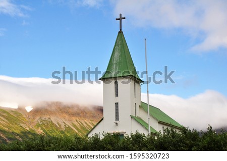 Church surrounded by mountains in Western Iceland