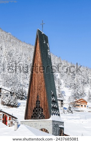 Church tower of the oldtown in Saas-Fee. Winter 2024.