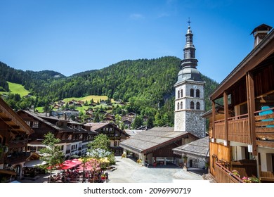 Church and the village of La Clusaz in summer, France