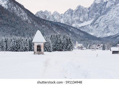 Church votive German tradition. Popular religiosity in Friuli. Winter, snow. - Powered by Shutterstock