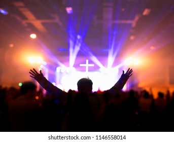 Church worship concept:Silhouette of Christian prayers raising hand while praying to the Jesus - Shutterstock ID 1146558014