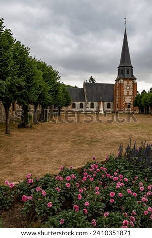 A church and its yard in the rural village of Acquigny, in Normandy, France