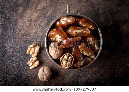 Churchkhela Pestil or Walnut Fruit Pulp in bowl on dark background.