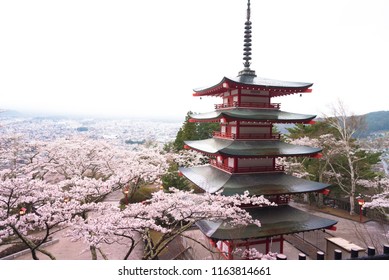 Chureito Pagoda with white cloudy sky in Sakura Cherry blossom, Yamanashi, Japan - Shutterstock ID 1163814661