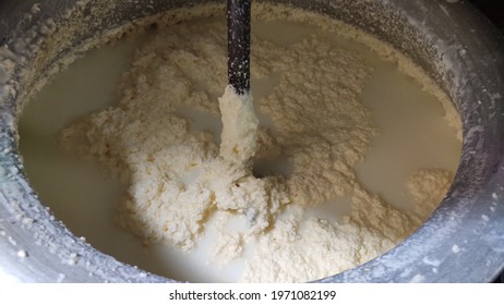  Churning butter with buttermilk in churn, extracting of Ghee from curd.  - Shutterstock ID 1971082199