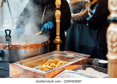 Churreria Cooking Churros On Street Market. Churros Is A Traditional Spain Street Fast Food. Selective Focus, Copy Space.