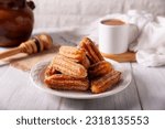 Churros. Fried wheat flour dough, a very popular sweet snack in Spain, Mexico and other countries where it is customary to eat them for breakfast or snack accompanied by hot chocolate or coffee.