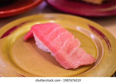 Chutoro Nigiri Sushi ( Raw Medium Fatty Bluefin Tuna Meat Sushi ). Fine Maguro Chutoro Nigiri Sushi. Close Up Japanese Original Style Food On The Golden Plate. Famous Raw Cut For Tuna Fish. 