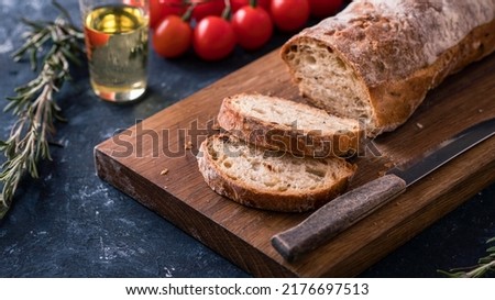 Ciabatta bread  on wooden cutting board. Fresh crispy Ciabatta bread. 