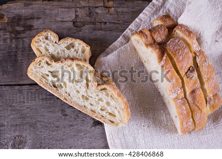 ciabatta, fresh bread, fresh ciabatta on the table. Italian ciabatta bread cut in slices. 