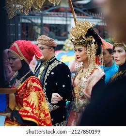 Cianjur, Indonesia - Sep 2018: Newly Married Groom And Bride Wearing Traditional Dress In A Parade On A Minangkabau Culture Wedding Ceremony. 