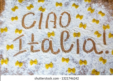 Ciao Italia Words Written On Table Composition With Flour And Pasta 