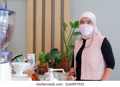 Cibubur, Indonesia - June 7th 2022: Woman Enjoying Coffee In A Coffee Cafe