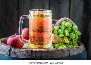 Cider Beer With Ingredients On Old Barrel