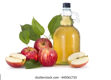 Cider and red apples with green leaves on white background