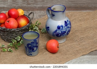 Cider In Traditional Blue Clay Jug.