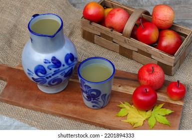 Cider In Traditional Blue Clay Jug.