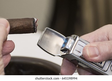 Cigar Being Lit By A Lighter