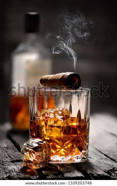 Download Cigar Glass Whiskey Ice Cubes Stock Photo Edit Now 1109203748 Yellowimages Mockups