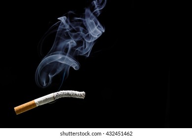 Cigarette Burning And Smoke With  Black Background