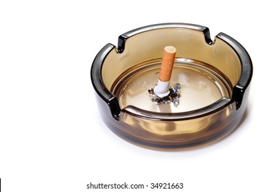 Cigarette Butt In Ash Tray. Side View. Isolated