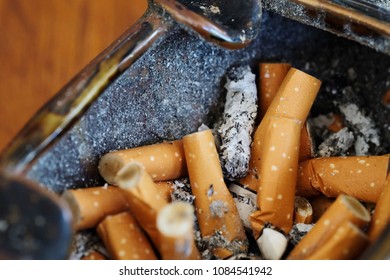 Cigarette Butt In Brown Ashtray, Risk Of Lung Cancer And Many Health Problem, Cause Of Respiratory Disease And Death Affect Health And Financial Problem, Should Promote And Support Stop Smoking Day