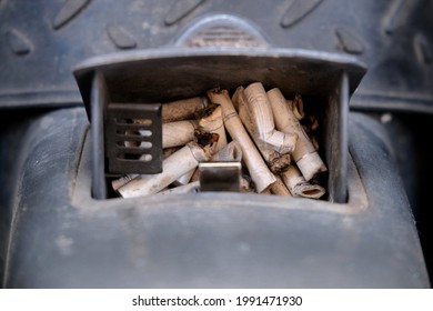 Cigarette Butts In Car Ashtray Close Up.