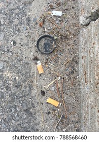 Cigarette butts on asphalt - Shutterstock ID 788568460