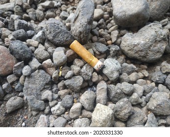 cigarette butts on the rocks 