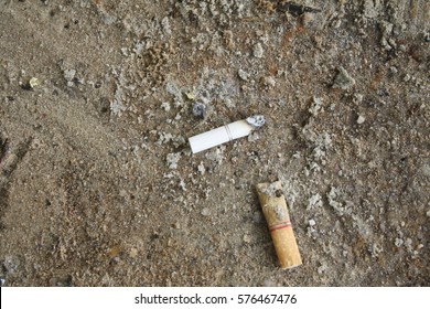Cigarette butts in the sand