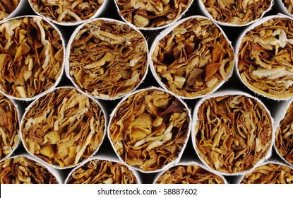 Cigarette Ends with Tobacco as Background