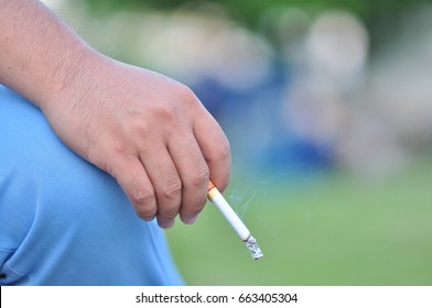 Cigarette in hand