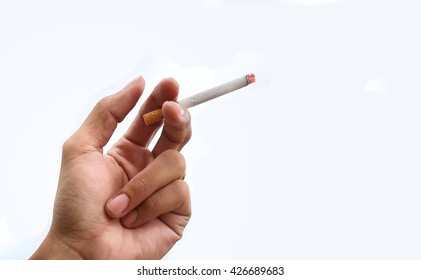 Cigarette In Hand On White Background.